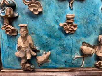 A Chinese square fahua 'Immortals' plaque mounted in a wooden table screen, Ming