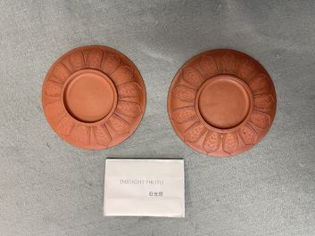 A pair of Chinese Yixing stoneware dishes with applied design, Kangxi