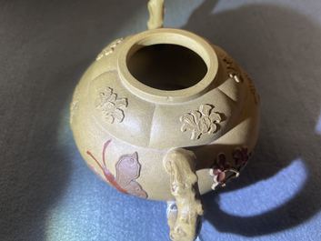 A bichrome Chinese Yixing stoneware teapot and cover with applied design, Kangxi