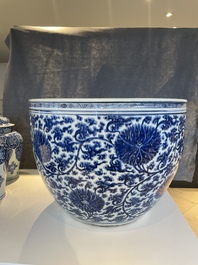 An exceptionally large Chinese blue and white 'lotus scroll' fish bowl, Kangxi