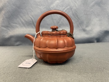 A Chinese Yixing stoneware chrysanthemum-shaped teapot and cover, Yongzheng/Qianlong