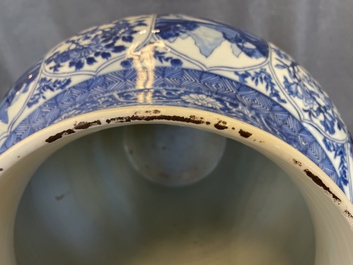 A massive Chinese blue and white vase with floral and landscape panels, Kangxi