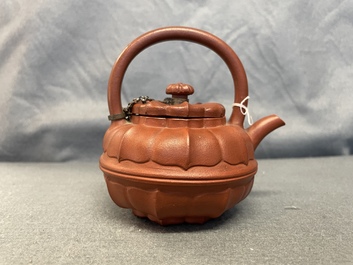 A Chinese Yixing stoneware chrysanthemum-shaped teapot and cover, Yongzheng/Qianlong