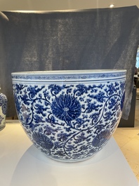 An exceptionally large Chinese blue and white 'lotus scroll' fish bowl, Kangxi