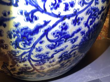 An exceptionally large Chinese blue and white 'lotus scroll' fish bowl, Kangxi