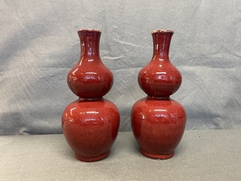 A pair of Chinese sang de boeuf-glazed double gourd vases, 19th C.