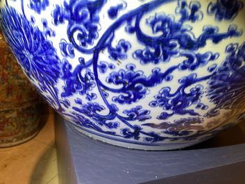 An exceptionally large Chinese blue and white 'lotus scroll' fish bowl, Kangxi