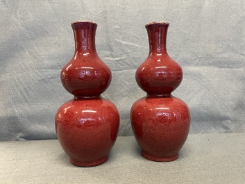 A pair of Chinese sang de boeuf-glazed double gourd vases, 19th C.