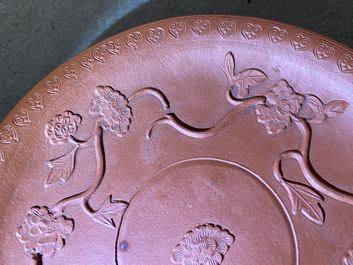 A pair of Chinese Yixing stoneware dishes with applied design, Kangxi