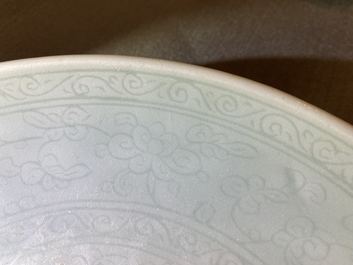 A Chinese monochrome celadon-glazed dish with underglaze design, Qianlong