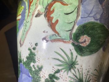 A Chinese wucai 'mythical beasts' vase and cover, Transitional period