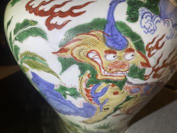 A Chinese wucai 'mythical beasts' vase and cover, Transitional period