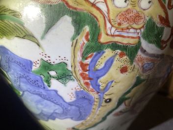 A Chinese wucai 'mythical beasts' vase and cover, Transitional period