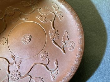 A pair of Chinese Yixing stoneware dishes with applied design, Kangxi