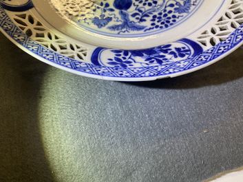 A pair of Chinese blue and white 'reticulated border' plates, Kangxi