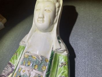 A Chinese verte biscuit group of Guanyin on a lotus throne, Kangxi