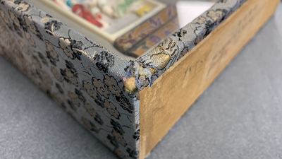 A pair of Chinese polychrome carved wrist rests in presentation box, Republic