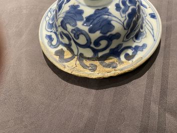 A pair of Chinese blue and white 'lotus scroll' vases and covers, Kangxi
