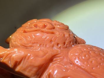 A Chinese carved red coral model of a Buddhist lion, 19/20th C.
