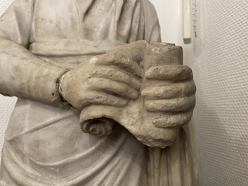 A Roman marble statue of a philosopher holding a parchment roll, ca. 2nd C.