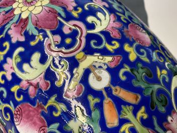 A Chinese famille rose blue-ground vase, 19th C.