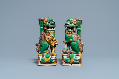 A pair of Chinese sancai-glazed biscuit Buddhist lion joss stick holders, Kangxi