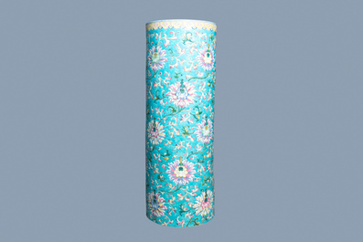 A large Chinese famille rose cylindrical vase with molded lotus scrolls, Jiaqing/Daoguang
