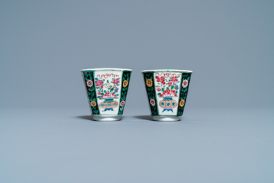 A pair of Chinese octagonal famille rose cups and saucers, Qianlong