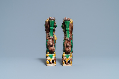 A pair of Chinese sancai-glazed biscuit Buddhist lion joss stick holders, Kangxi