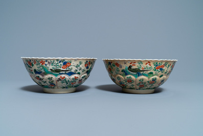 A pair of Chinese famille verte caf&eacute;-au-lait-ground lotus-molded bowls, Kangxi