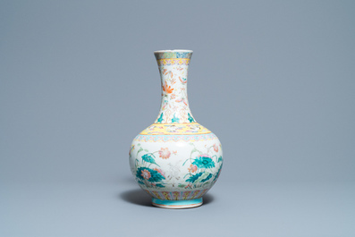 A Chinese famille rose bottle vase with mandarin ducks in a lotus pond, 19th C.