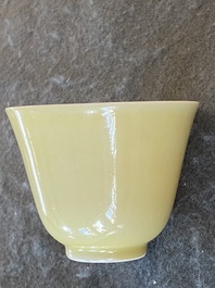 A pair of Chinese monochrome yellow wine cups, Kangxi mark and of the period