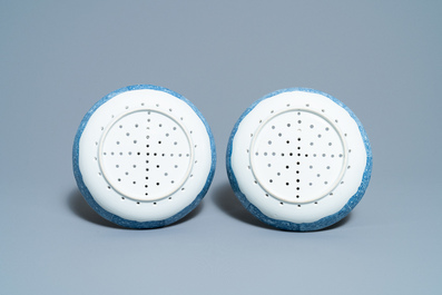 A pair of Chinese blue and white strainer dishes with ladies in a garden, Qianlong