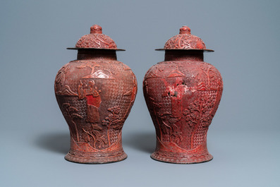 A pair of Chinese red cinnabar lacquer vases and covers, Zhengde mark, Qing