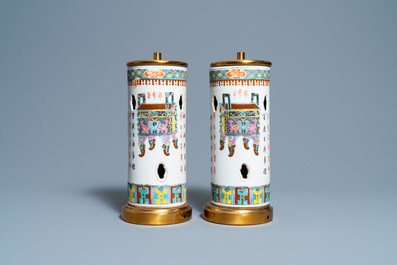 A pair of Chinese reticulated famille rose hat stands mounted as lamps, 19th C.