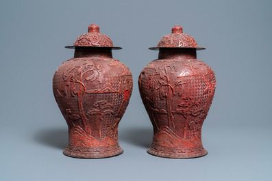 A pair of Chinese red cinnabar lacquer vases and covers, Zhengde mark, Qing