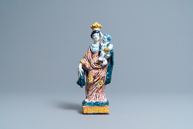 A polychrome Dutch Delft figure of the Madonna with child, 18th C.