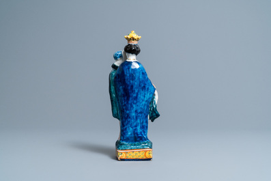 A polychrome Dutch Delft figure of the Madonna with child, 18th C.