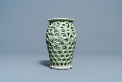 A Chinese reticulated monochrome Longquan celadon brush pot, Ming