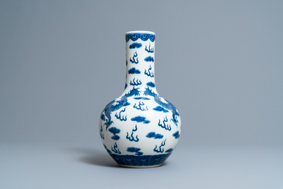 A Chinese blue and white 'dragons' bottle vase, Yongzheng mark, 19th C.