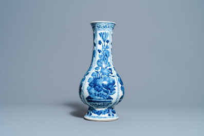 A Chinese blue and white bottle vase with flower arrangements, Kangxi