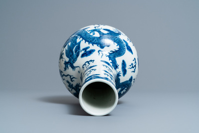 A Chinese blue and white 'dragons' bottle vase, Yongzheng mark, 19th C.