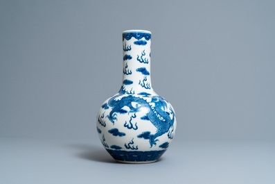 A Chinese blue and white 'dragons' bottle vase, Yongzheng mark, 19th C.