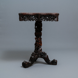 A Chinese carved wooden side table with marble chessboard top, 19th C.