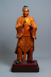 A massive Chinese gilded wooden figure of a standing male, 18/19th C.