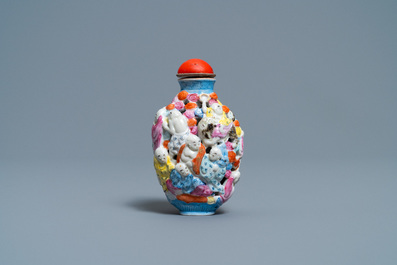 A Chinese famille rose molded, reticulated and double-walled '18 Luohans' snuff bottle, Qianlong mark, 19th C.