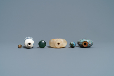 Three Chinese chalcedony, cloisonn&eacute; and porcelain snuff bottles, 19th C.