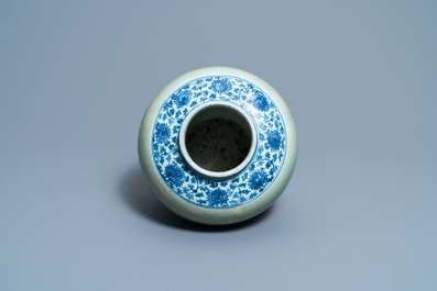 Een Chinese blauw-witte en celadon vaas met lotusslingers, Ming