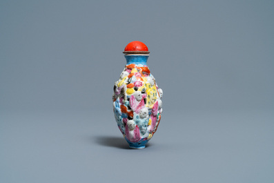 A Chinese famille rose molded, reticulated and double-walled '18 Luohans' snuff bottle, Qianlong mark, 19th C.