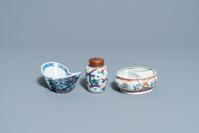 A Chinese doucai bowl, a famille verte spice box and a wucai tea caddy, Kangxi and later